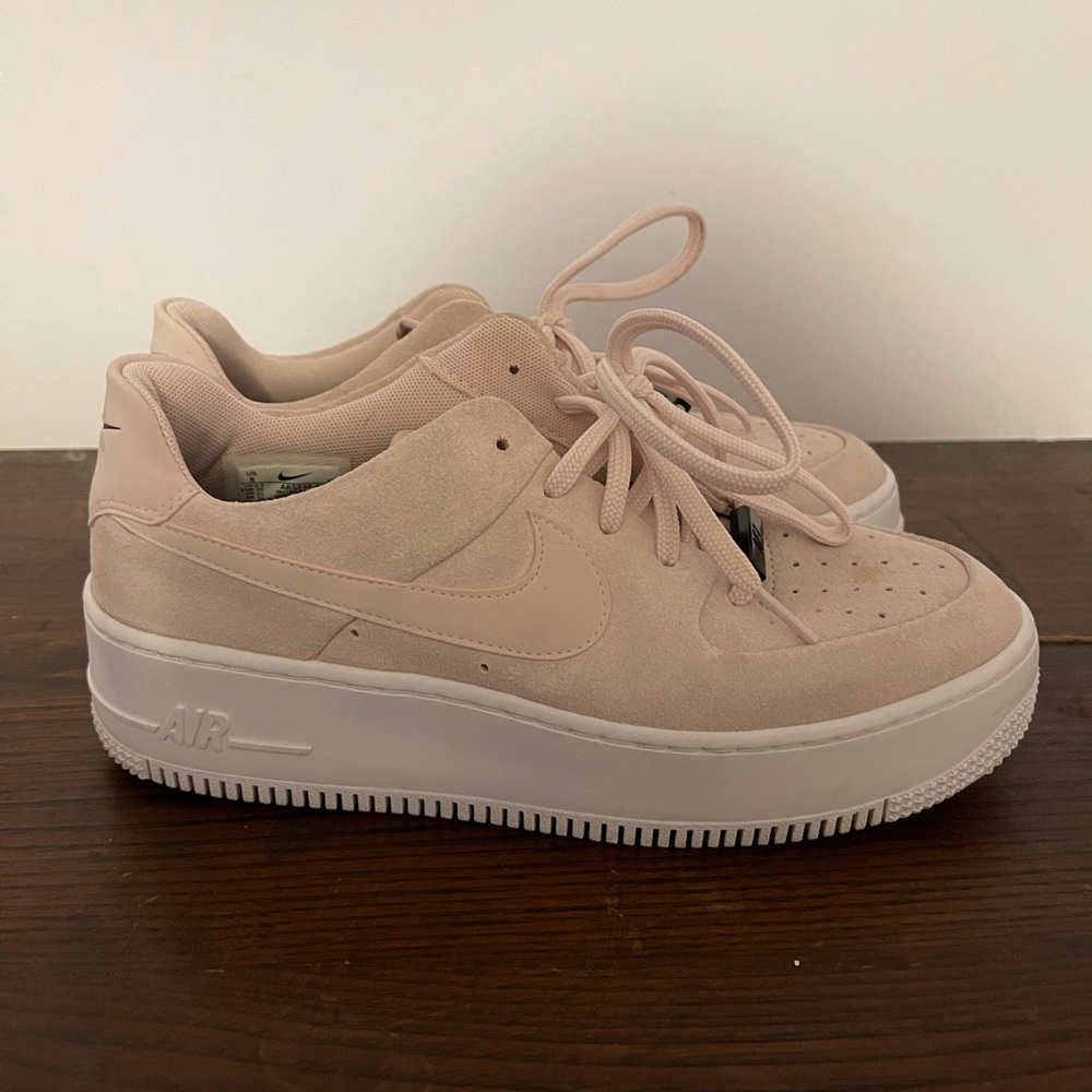 Womans Nike’s suede pink sneakers size 8.